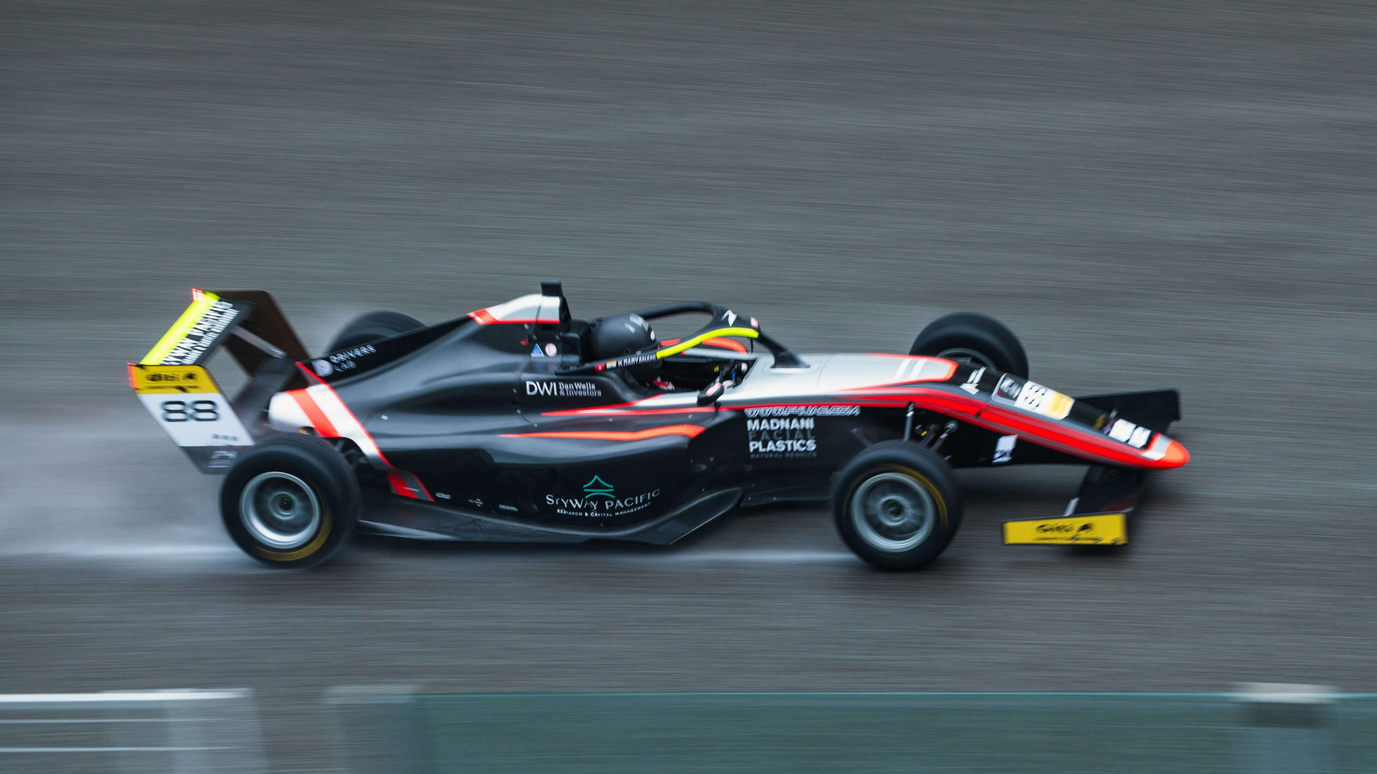 Modern Formula 1 race car speeding around track corner